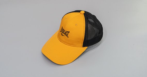 How does a baseball cap move from a seaside town to the world?